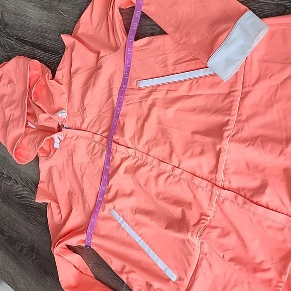 Lululemon Sun Showers Rain Jacket in Grapefruit/White Size 6