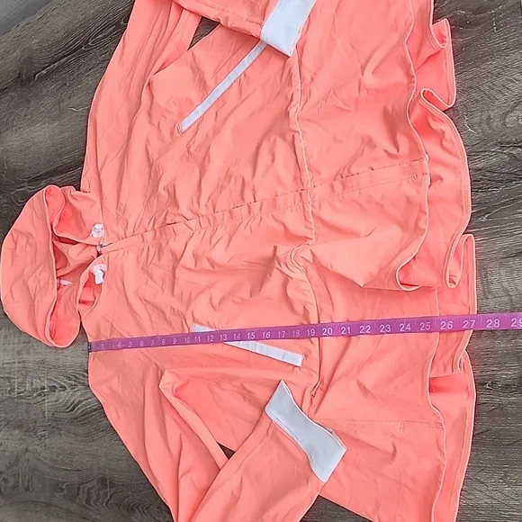 Lululemon Sun Showers Rain Jacket in Grapefruit/White Size 6