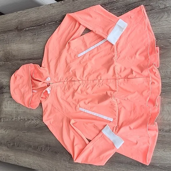 Lululemon Sun Showers Rain Jacket in Grapefruit/White Size 6