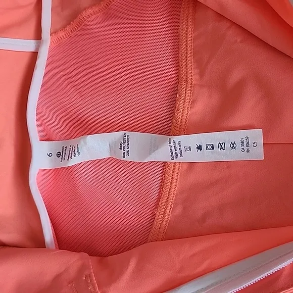 Lululemon Sun Showers Rain Jacket in Grapefruit/White Size 6