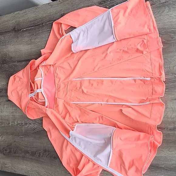 Lululemon Sun Showers Rain Jacket in Grapefruit/White Size 6